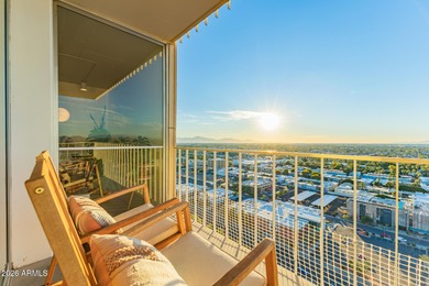 This stunning corner-unit apartment offers high-rise living with