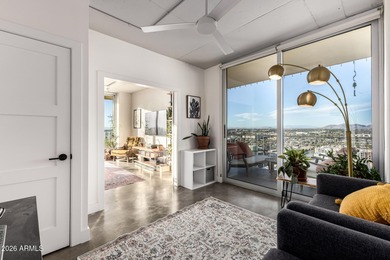 This stunning corner-unit apartment offers high-rise living with