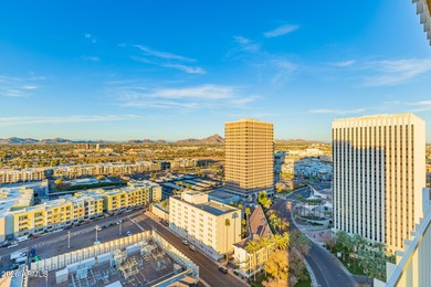This stunning corner-unit apartment offers high-rise living with