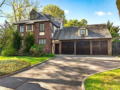 This extraordinary Tudor mansion sits on an expansive 112x100 - photo 1