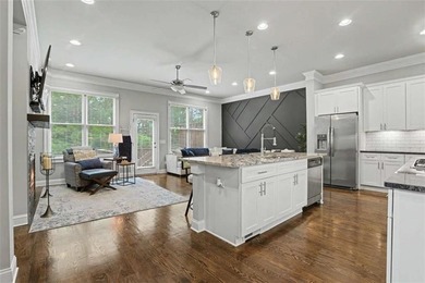 Experience elevated living in this exquisitely updated endunit - photo 5