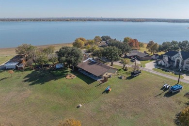 Beautiful single story lakefront home built on a cove  with no - Lake Home For Sale in Little Elm, Texas