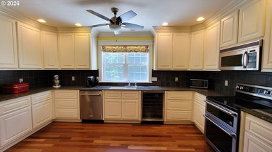 Stunning farmhouse & SHOP on 1.18 manicured acres! Nestled - photo 6