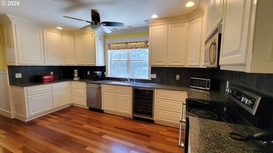Stunning farmhouse & SHOP on 1.18 manicured acres! Nestled - photo 7