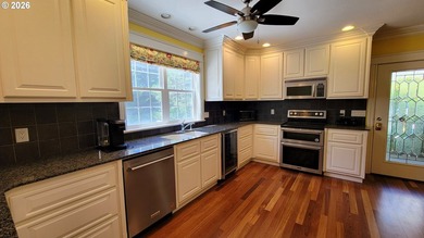 Stunning farmhouse & SHOP on 1.18 manicured acres! Nestled - photo 8