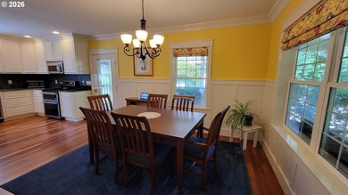 Stunning farmhouse & SHOP on 1.18 manicured acres! Nestled - photo 9