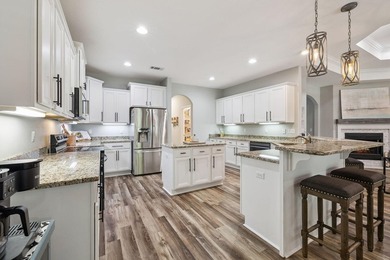 Love to entertain? This beautifully updated home in the gated - photo 12