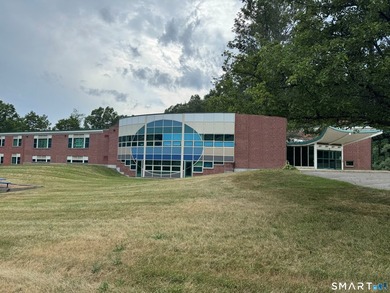 +/- 37,769 SF two-story building on a well-manicured 5.12-acre - photo 1