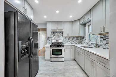 Welcome to this beautifully renovated 6-bedroom, 2-bath Colonial - photo 8