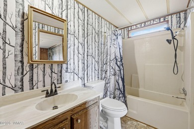 Tucked among the peaceful pines of Airpine, AZ, this remodeled