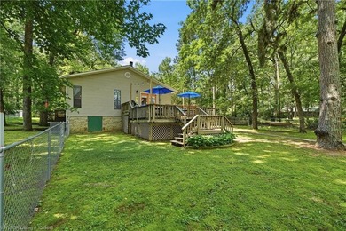 Tucked away along the shoreline of Lake Hamilton in a peaceful - photo 33