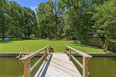 Tucked away along the shoreline of Lake Hamilton in a peaceful - photo 49