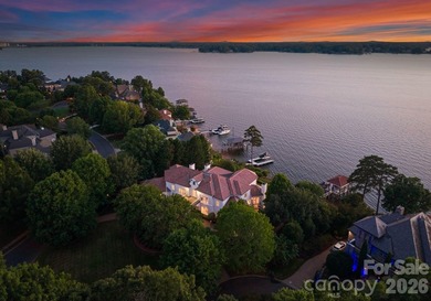 Perched elegantly above Lake Norman's eastern shore and uniquely - photo 1