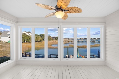 Wake up to sweeping marsh views, glowing sunsets, and the quiet