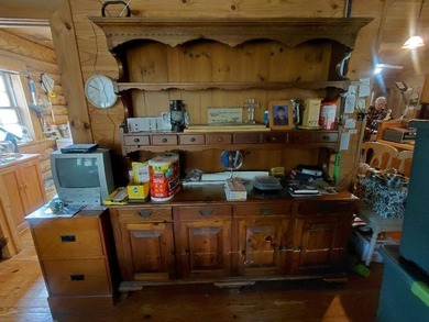 This 2-bedroom, 2-bathroom log cabin offers rustic charm. It is - photo 17