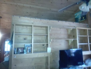 This 2-bedroom, 2-bathroom log cabin offers rustic charm. It is - photo 20