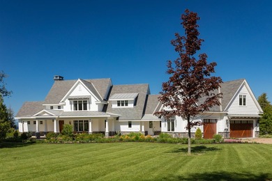 A willow-lined drive creates a grand approach to this Grand Isle - photo 2