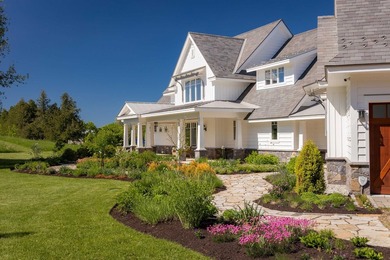 A willow-lined drive creates a grand approach to this Grand Isle - photo 3