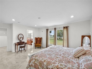 Welcome to this stunning waterfront home located on a rim canal - photo 11