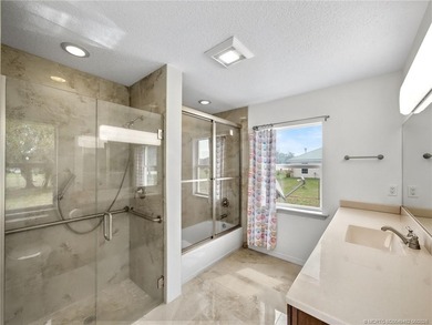 Welcome to this stunning waterfront home located on a rim canal - photo 12