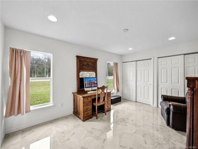 Welcome to this stunning waterfront home located on a rim canal - photo 13