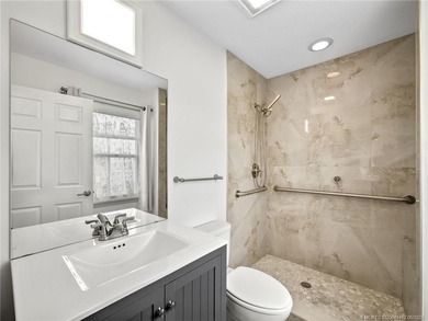 Welcome to this stunning waterfront home located on a rim canal - photo 16