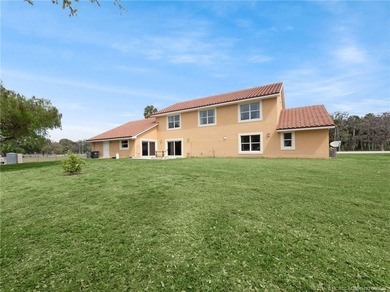 Welcome to this stunning waterfront home located on a rim canal - photo 26