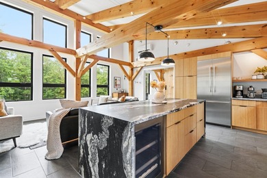 Discover a rare 10+ acre waterfront property encompassing two - photo 17