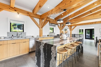 Discover a rare 10+ acre waterfront property encompassing two - photo 18