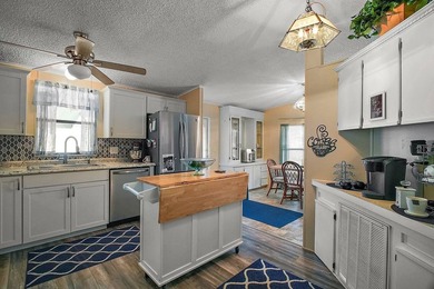 Nestled within the desirable Lake Griffin Habor, a vibrant - photo 4