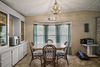 Nestled within the desirable Lake Griffin Habor, a vibrant - photo 5