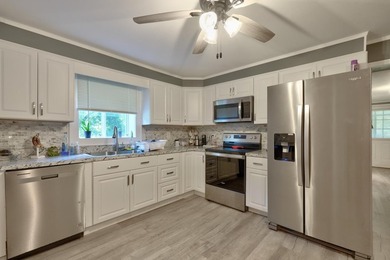 Welcome home to this beautifully updated 4-bedroom, 3-bath - photo 33