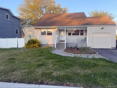 Welcome to this beautifully updated cape-style home situated on - photo 1