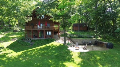 Escape to this cabin-style retreat with gorgeous river views and - photo 1