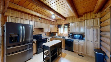 Escape to this cabin-style retreat with gorgeous river views and - photo 5