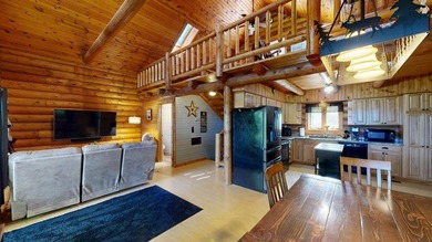 Escape to this cabin-style retreat with gorgeous river views and - photo 6