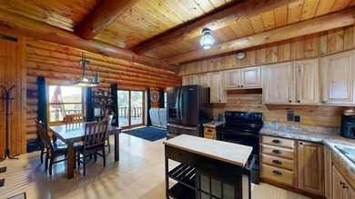 Escape to this cabin-style retreat with gorgeous river views and - photo 7
