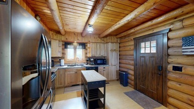 Escape to this cabin-style retreat with gorgeous river views and - photo 8