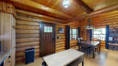 Escape to this cabin-style retreat with gorgeous river views and - photo 9
