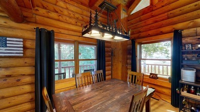 Escape to this cabin-style retreat with gorgeous river views and - photo 10