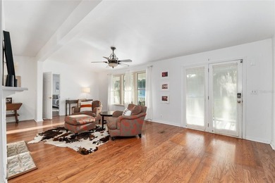 Tucked away among majestic live oaks and native palms, this - photo 12