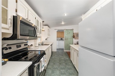 Tucked away among majestic live oaks and native palms, this - photo 29