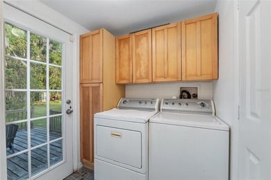 Tucked away among majestic live oaks and native palms, this - photo 30
