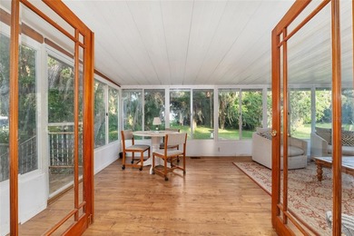 Tucked away among majestic live oaks and native palms, this - photo 44