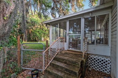 Tucked away among majestic live oaks and native palms, this - photo 49