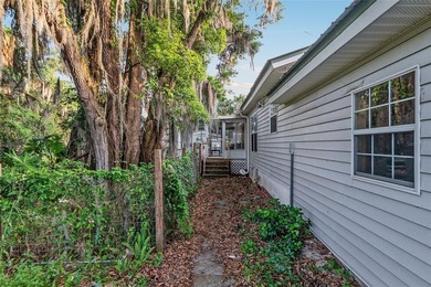 Tucked away among majestic live oaks and native palms, this - photo 50