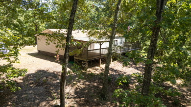 Home with 3.2 acres near lake with 3 campsites. - photo 2