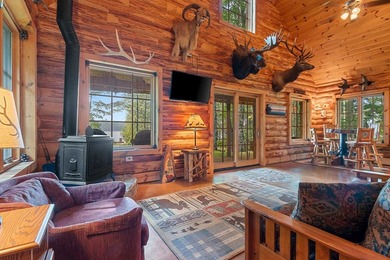 Experience true Northwoods living in this beautiful full log - photo 11