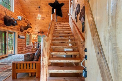 Experience true Northwoods living in this beautiful full log - photo 12