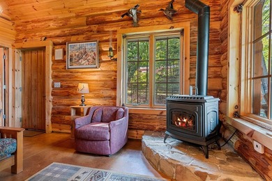 Experience true Northwoods living in this beautiful full log - photo 14